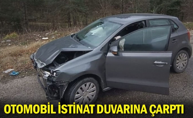 Otomobil istinat duvarına çarptı